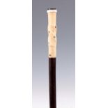 A LATE 19TH CENTURY GENTLEMANS WALKING CANE with mother of pearl inlaid twisted ivory handle and