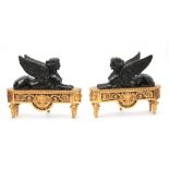 A PAIR OF 19TH CENTURY GILT ORMOLU AND PATINATED BRONZE SPHINX CHENETS / FIRE DOGS with winged
