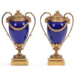 A PAIR OF 19TH CENTURY FRENCH ORMOLU MOUNTED ROYAL BLUE PORCELAIN URN-SHAPED VASES with square