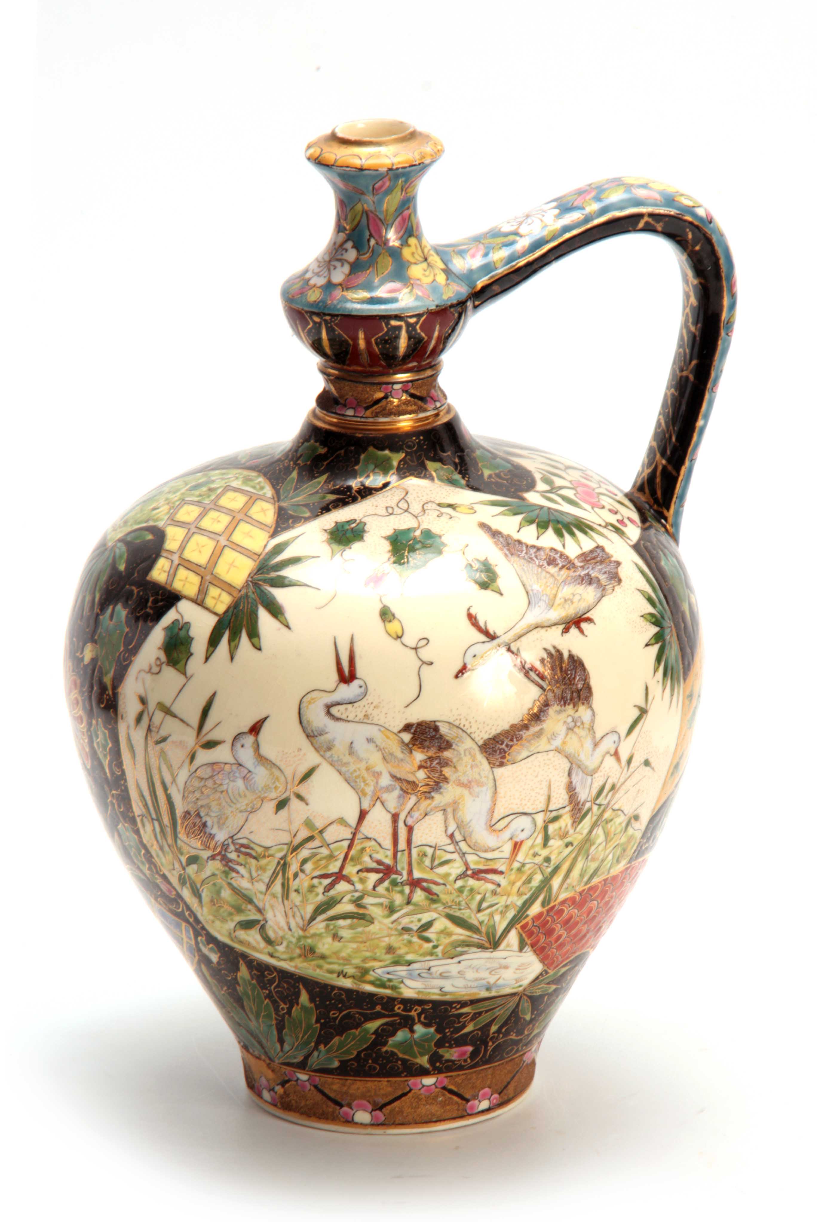 AN EARLY 20TH CENTURY HUNGARIAN FISCHER BUDAPEST WATER JUG decorated with birds and floral work