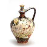 AN EARLY 20TH CENTURY HUNGARIAN FISCHER BUDAPEST WATER JUG decorated with birds and floral work