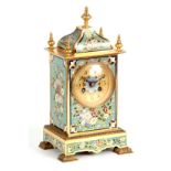 A LATE 19TH CENTURY FRENCH GILT BRASS AND CHAMPLEVE ENAMEL MANTEL CLOCK with moulded edge stepped