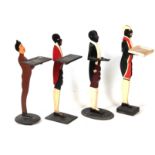 FOUR EARLY 20TH CENTURY FIGURAL DUMB WAITERS three decorated as blackamore figures and one decorated