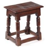 A LATE 17th CENTURY OAK JOINT STOOL with pegged moulded edge top above bulbous ring-turned legs