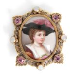 A 19TH CENTURY OVAL PORCELAIN MINIATURE PORTRAIT BROOCH with elaborate gilt metal frame set with