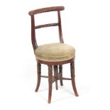 AN EARLY 19TH CENTURY MAHOGANY MUSIC CHAIR POSSIBLY IRISH with rope twist shaped top rail above a