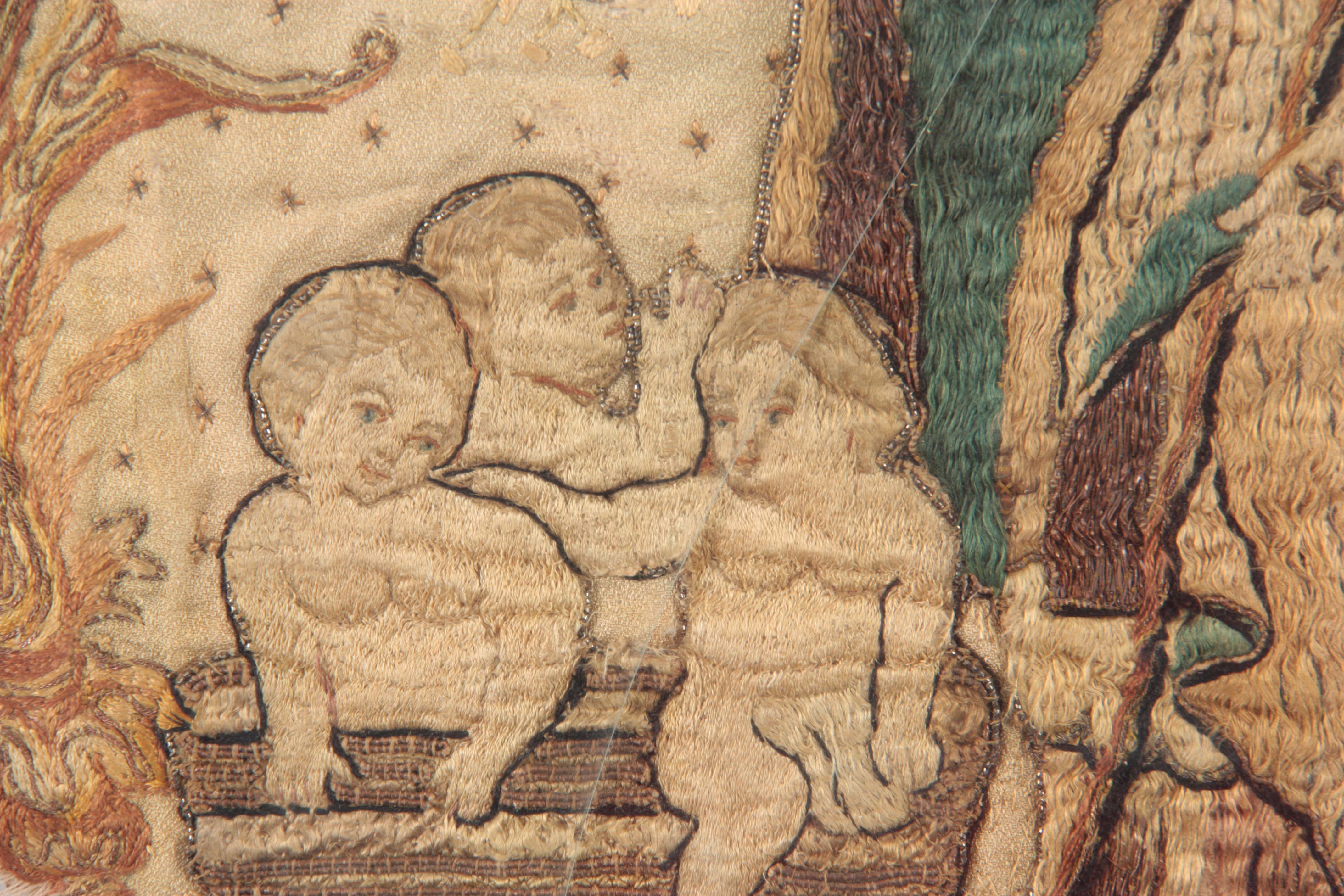 A 17TH CENTURY SILK EMBROIDERED STUMPWORK PANEL depicting a standing Saint with three infants in a - Image 6 of 8
