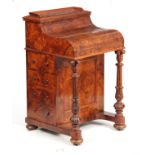 AN EARLY VICTORIAN BURR WALNUT PIANO TOP 'POP-UP' DAVENPORT the moulded galleried pop-up top section