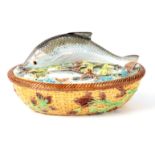 A LATE 19th CENTURY MAJOLICA SARDINE DISH AND COVER IN THE MANNER OF GEORGE JONES the oval lid