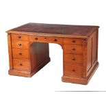 GILLOWS, LANCASTER. AN EARLY 19TH CENTURY OAK PARTNERS DESK with original tooled leather top with