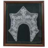 A LATE 19TH CENTURY FRAMED IRISH LACEWORK COLLAR in a moulded frame, the frame is 43cm wide, 48cm
