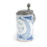 AN 18TH CENTURY GERMAN BLUE AND WHITE PEWTER MOUNTED DELFT TANKARD bearing inscription ‘Das bie