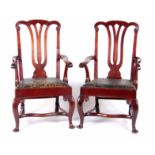 A LARGE PAIR OF GEORGE I STYLE WALNUT ARMCHAIRS with scroll carved open pierced back splats, open