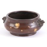 A CHINESE BRONZE CENSER with lion mask handles having gold splash decoration bearing six-character