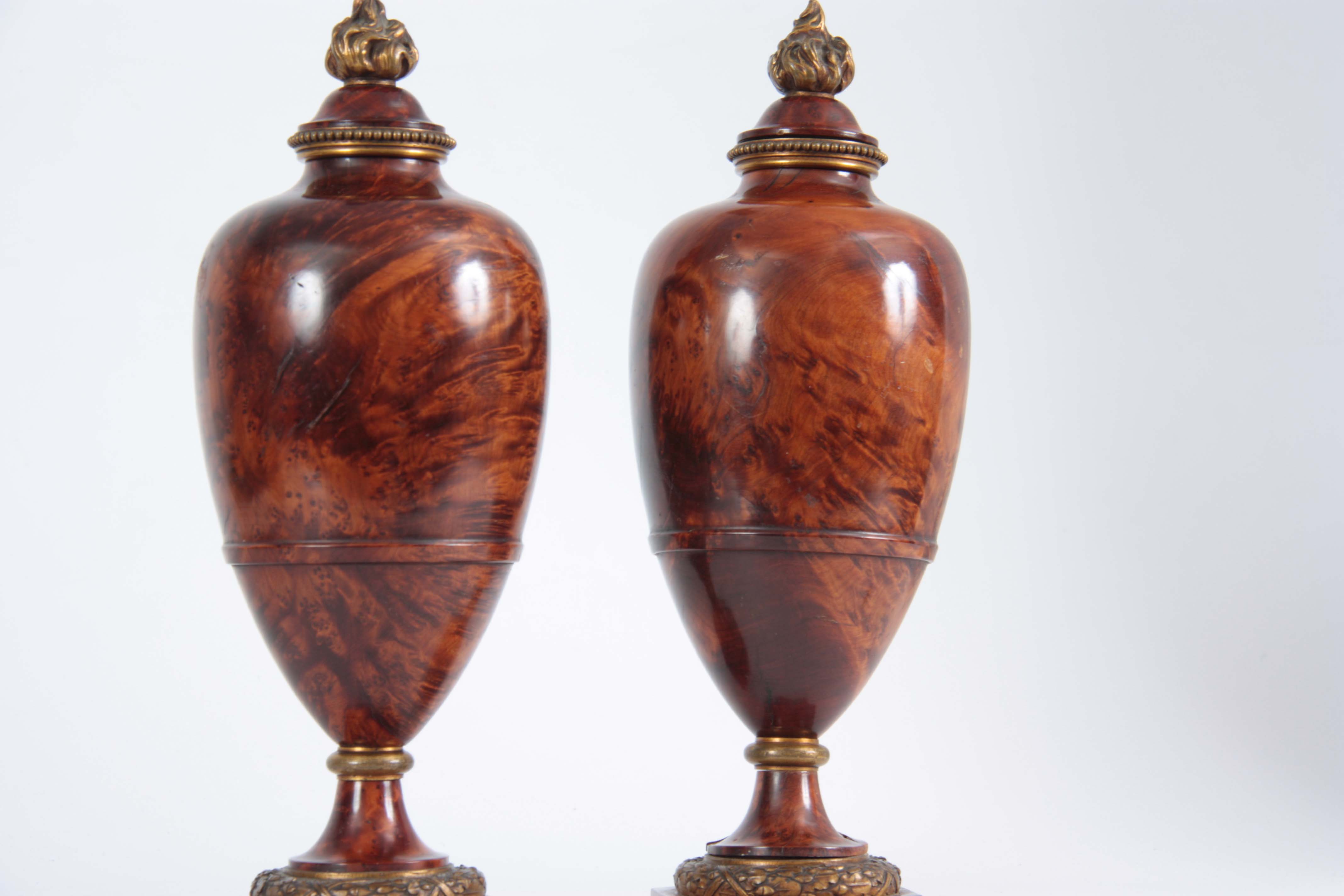 A FINE PAIR OF 19TH CENTURY BURR YEW-WOOD ORMOLU MOUNTED URNS with flame finials and bulbous - Image 2 of 4