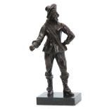 A LATE 19th CENTURY PATINATED BRONZE FIGURE modelled as a standing cavalier mounted on black