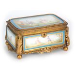 A 19TH CENTURY FRENCH SEVRES STYLE PORCELAIN PANELLED AND GILT METAL MOUNTED JEWELLERY CASKET with a