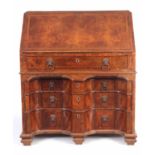 AN UNUSUAL LATE 17TH CENTURY TWO SECTIONAL BURR WALNUT BUREAU with double shaped kneehole to the