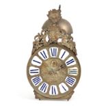 AN 18TH CENTURY FRENCH LANTERN CLOCK with embossed 8.5" brass dial with porcelain Roman numerals