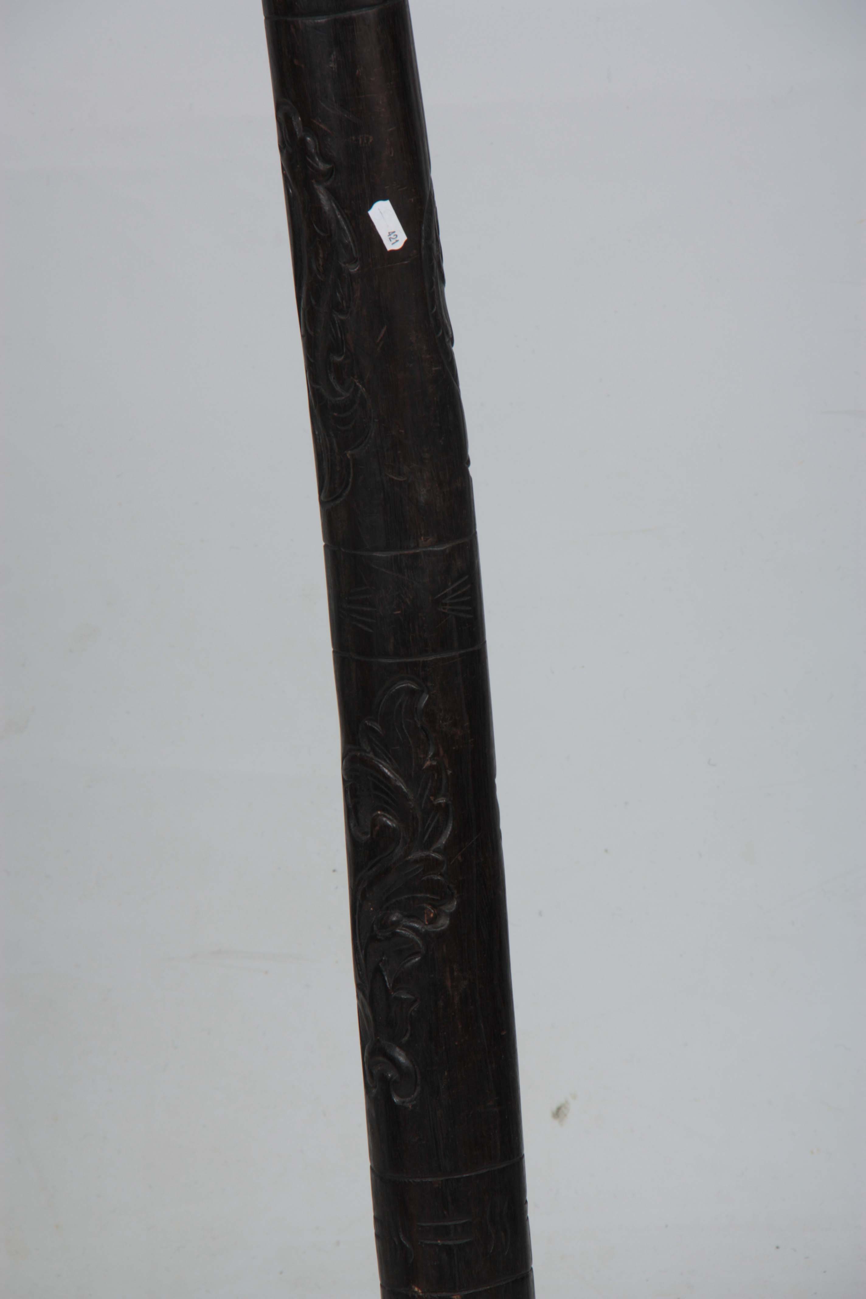 A 20TH CENTURY CARVED HARDWOOD DIDGERIDOO 124cm overall. - Image 2 of 2