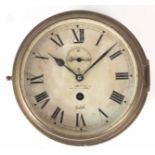 AN EARLY 20th CENTURY BRASS CASED SHIPS CLOCK with Roman dial fronting an eight-day spring driven
