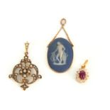 A COLLECTION OF THREE VINTAGE GOLD PENDANTS to include a 10ct gold and Wedgewood oval pendant 29mm
