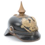 A WW1 GERMAN ' PIKELHAUBE ' LEATHER HELMET with brass spike and gilt brass eagle 21cm high