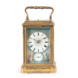 A 19TH CENTURY FRENCH GILT BRASS GORGE CASE REPEATING CARRIAGE CLOCK WITH ALARM the Sevres style