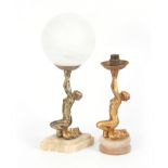 TWO 20TH CENTURY ART DECO PATINATED SPELTER FIGURAL LAMPS in the manor of Lorenzl having gold