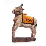 A CARVED AND PAINTED HINDU NANDI COW 31cm high 20cm wide