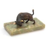 AN EARLY 20th CENTURY AUSTRIAN PATINATED BRONZE SCULPTURE modelled as a bull mounted on oval onyx