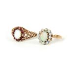 TWO LADIES 9CT GOLD AND OPAL RINGS both set with oval opals, one surrounded by smaller opals, the