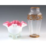 A 19TH CENTURY PINK LINED OPALINE GLASS VASE standing on a shell moulded tripod base, 11cm high,