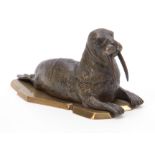 A LATE 19th CENTURY AUSTRIAN COLD PAINTED BRONZE INKWELL formed as a walrus lying on a glacier style