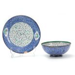 A 19th CENTURY PERSIAN ENAMEL ON COPPER BOWL AND PLATE with floral decoration and perched songbirds,