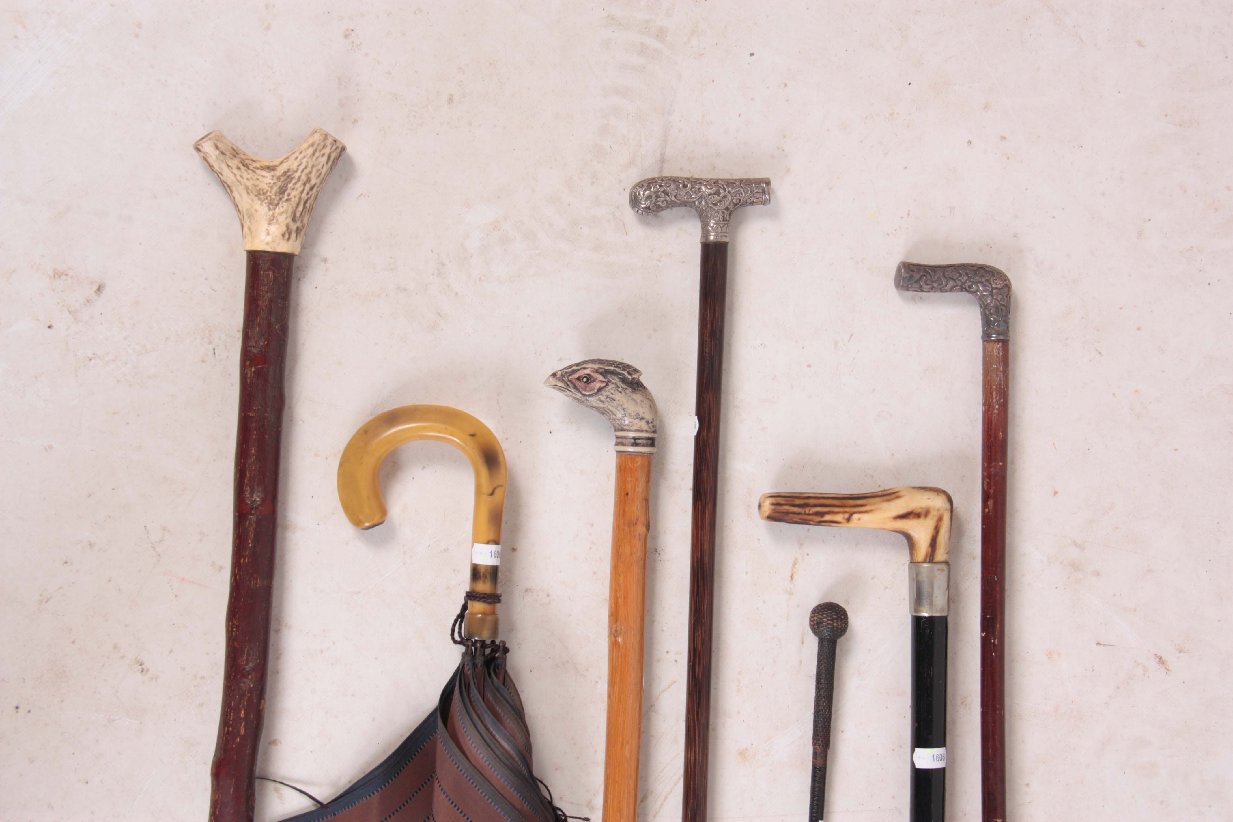 A SELECTION OF 19TH CENTURY AND LATER WALKING STICKS including two silver topped examples, a 19th- - Image 2 of 2