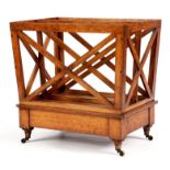 A STYLISH LATE 19TH CENTURY HONEY COLOURED OAK CANTERBURY with three X shaped book divides and a