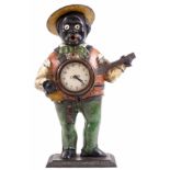 A LATE 19TH CENTURY AMERICAN PAINTED CAST IRON MANTLE CLOCK formed as a black banjo player with