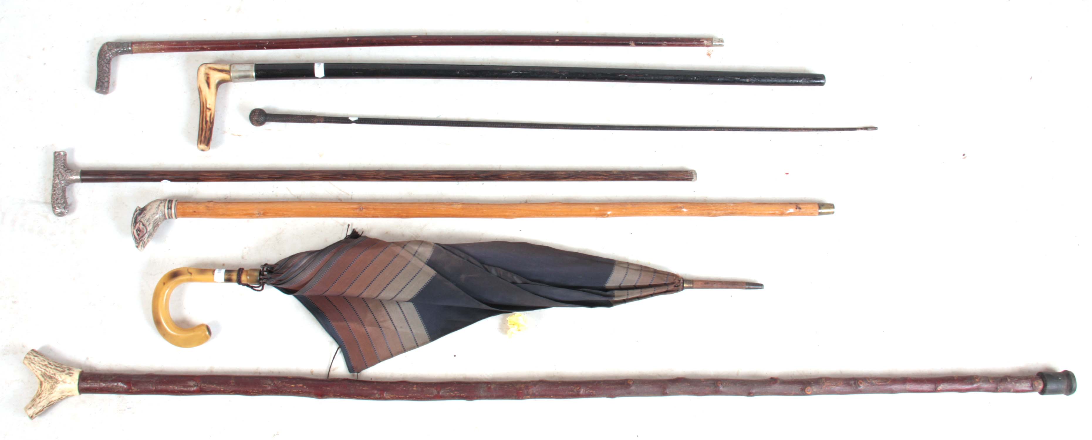 A SELECTION OF 19TH CENTURY AND LATER WALKING STICKS including two silver topped examples, a 19th-