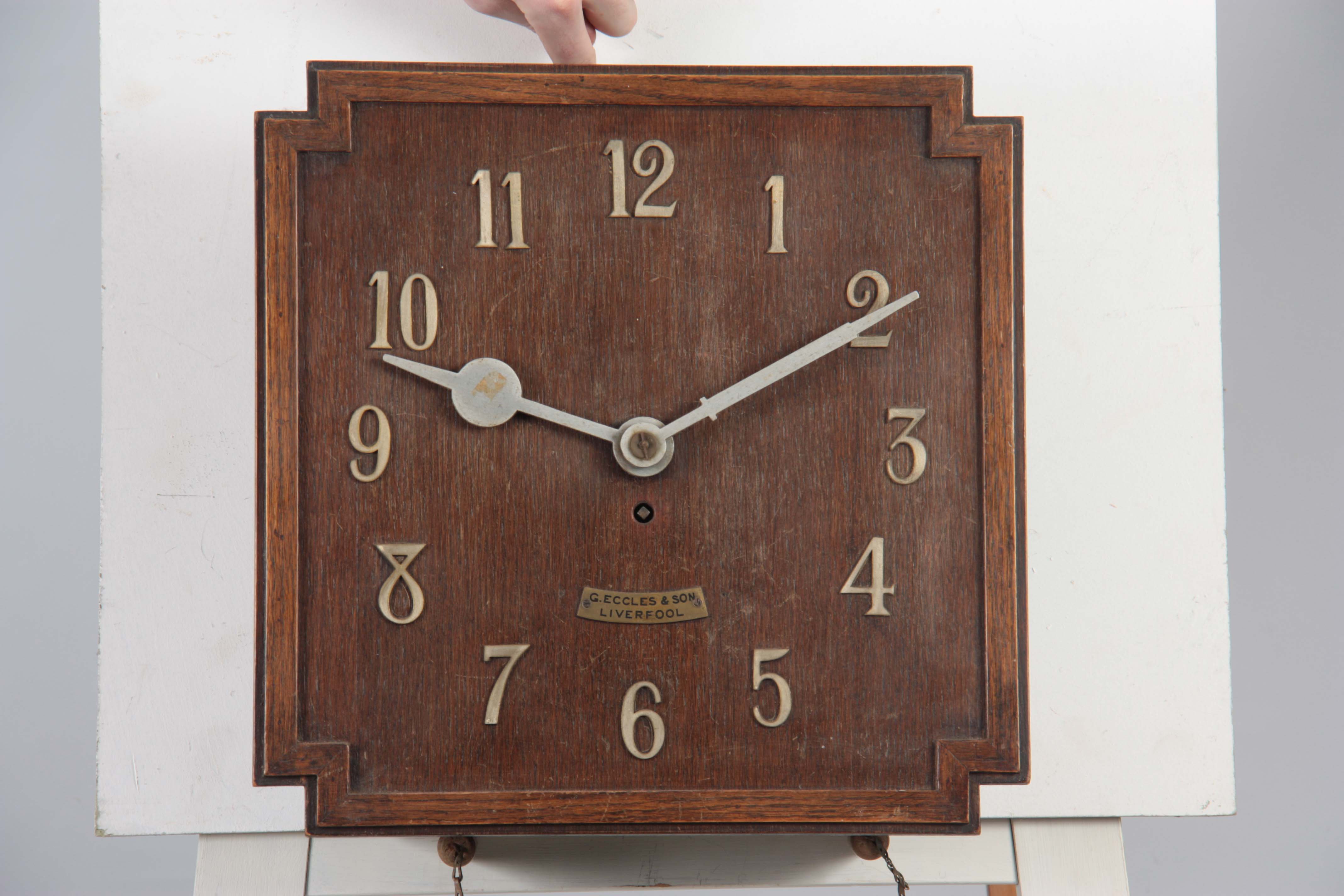 G. ECCLES & SON, LIVERPOOL. AN OAK ART DECO FUSEE WALL CLOCK the 38cm squared dial with applied - Image 4 of 10