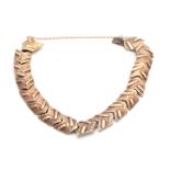 A LADIES 9CT GOLD BRACELET with arrowhead links app. 22g