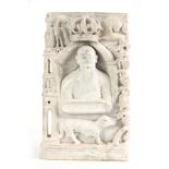 AN UNUSUAL CARVED WHITE MARBLE ANGLO INDIAN BUDDHA decorated with a Royal coat of arms to the top