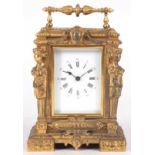 A LATE 19th CENTURY FRENCH GILT CASED CARRIAGE CLOCK with figural columns enclosing a 2.25"