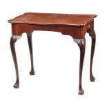 A GEORGE II MAHOGANY IRISH SILVER TABLE with shaped moulded edge top, with pull-out slides; standing