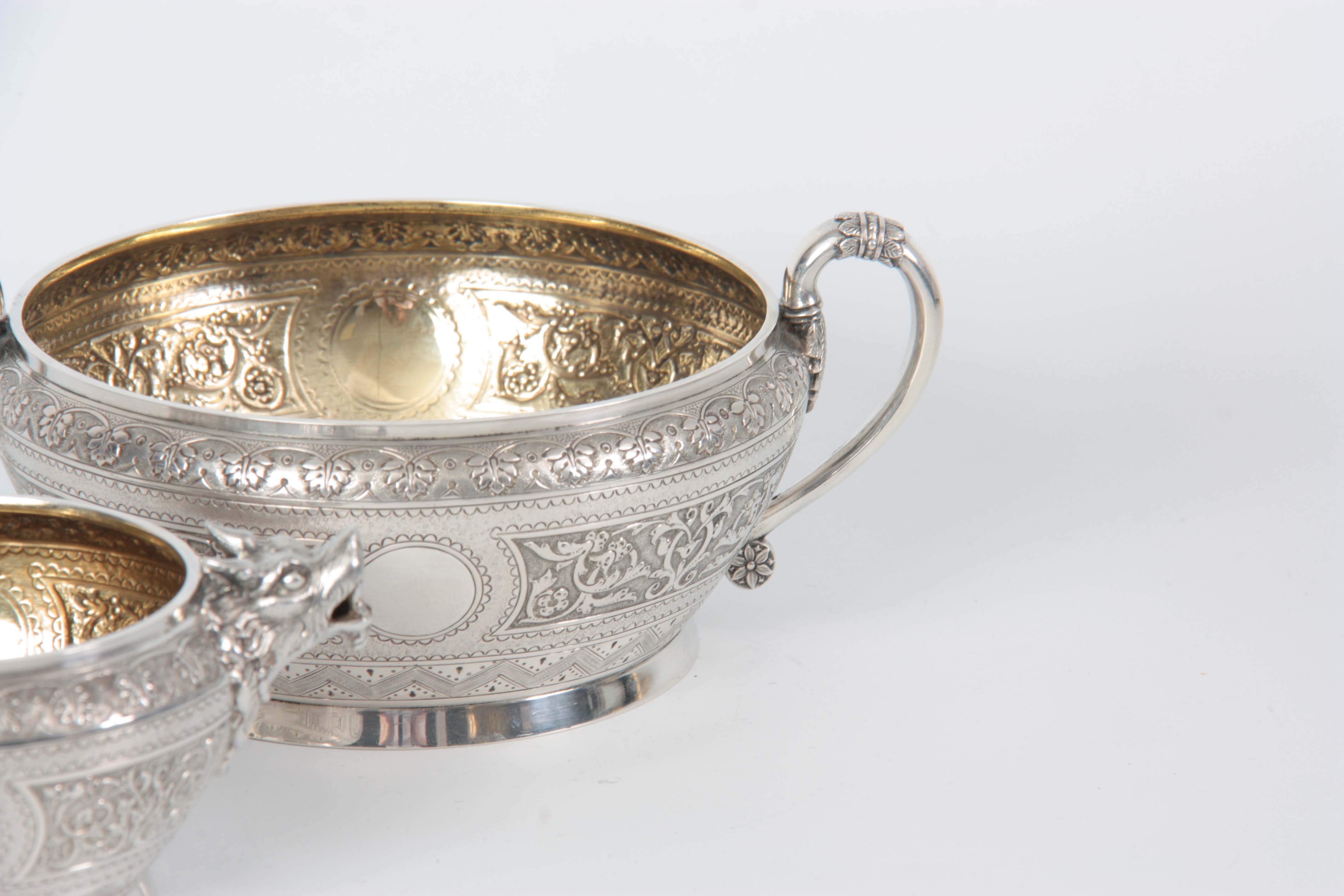A VICTORIAN SILVER AND GILT CREAM JUG AND SUGAR BOWL having relief scroll-work panels and fine - Image 4 of 7
