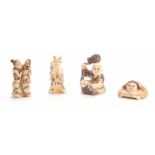 A COLLECTION OF FOUR EARLY 20th CENTURY IVORY NETSUKE sculptured as various figures all with
