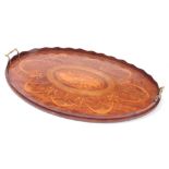 A 19TH CENTURY INLAID MAHOGANY OVAL TRAY with brass side handles and wavey edge gallery 71cm wide