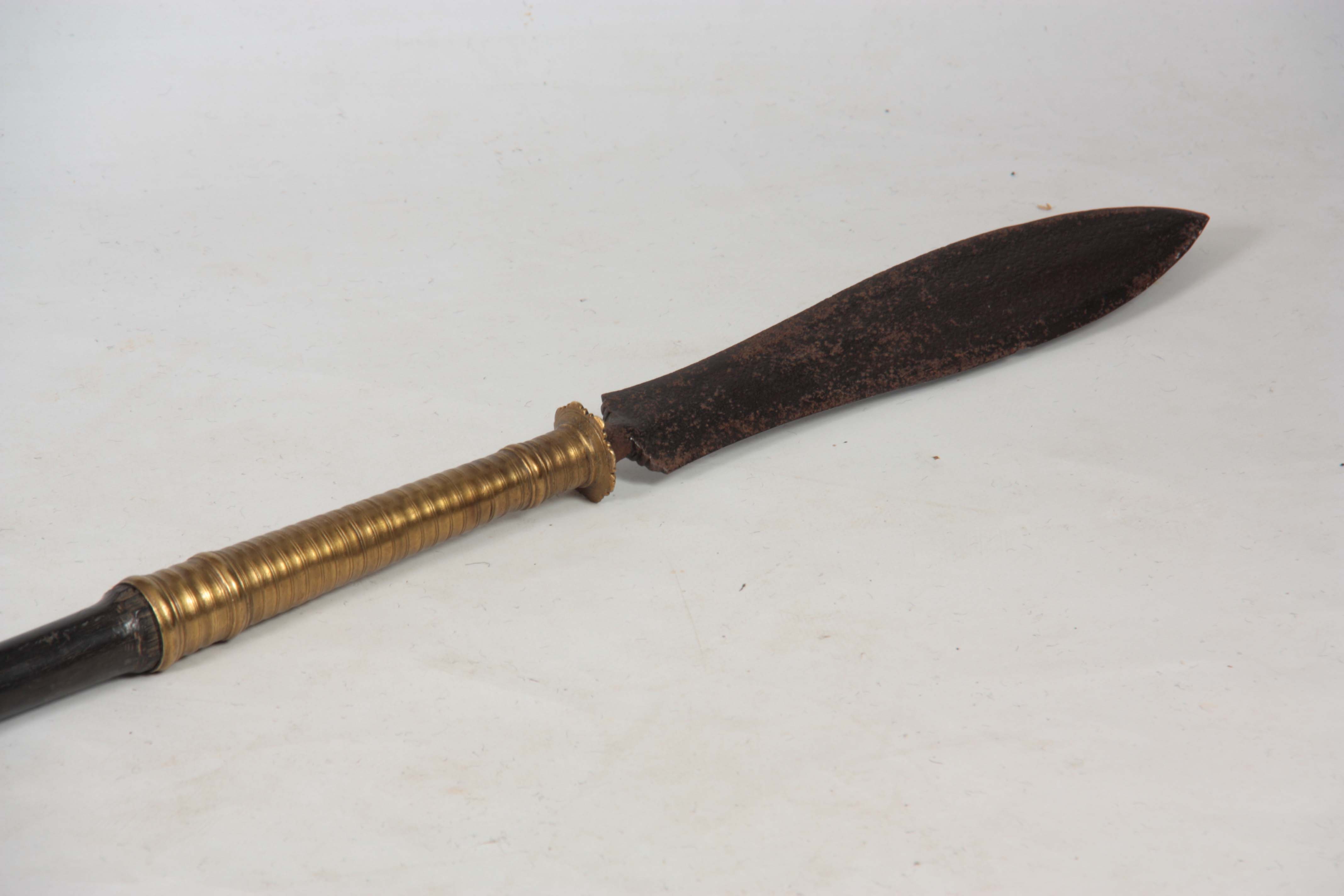 A 19TH CENTURY AFRICAN TRIBAL SPEAR with flattened iron blade and ringed brass shank on a heavy - Image 2 of 4