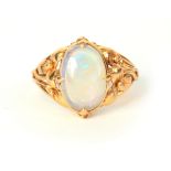 A LARGE LADIES 14CT GOLD OPEL SET RING having a large oval opal on floral setting, opal measure 15mm