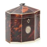 AN EARLY 19TH CENTURY IVORY STRUNG TORTOISESHELL OCTAGONAL TENT TOP TEA CADDY with unusual concave